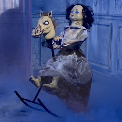 creepy doll on rocking horse